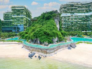 an aerial view of a beach with tall buildings at Flamingo Cát Bà in Cat Ba