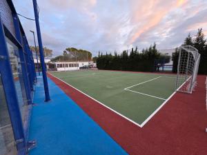 a tennis court with a net on top of it at Camping San Javier in San Javier