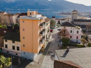 an overhead view of a city street with buildings at By THE LAKE in Muralto