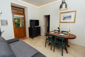 a living room with a table and a couch at Villa Almira in Izola