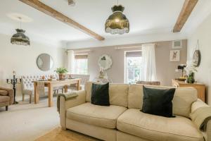 a living room with a couch and a dining room at 2 Bed in Blythburgh oc-w42765 in Blyford