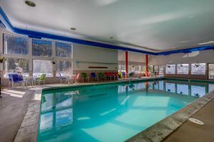 a swimming pool with blue water in a building at Lenawee #1727 in Keystone