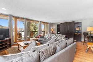 a living room with a couch and a tv at Lenawee #1727 in Keystone