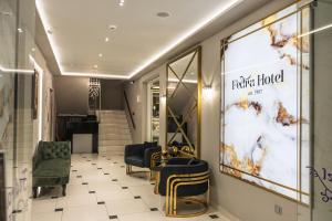 a store hallway with chairs and a large window at FEDRA HOTEL in Paralia Katerinis