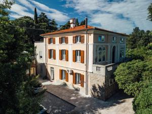 an aerial view of a white building with orange windows at Villa Almira in Izola
