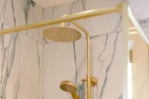 a shower with a shower head in a bathroom at 2 Bed in Sennen oc-k35172 in Sennen