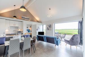 a kitchen and living room with a table and chairs at 2 Bed in Sennen oc-k35172 in Sennen +16 photos