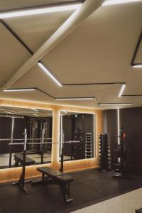 a gym with several equipment in a room at Best Western Plus John Bauer Hotel in Jönköping