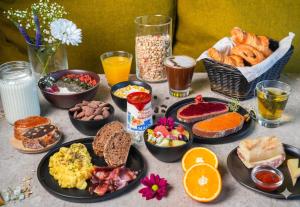 a table with a bunch of breakfast foods and drinks at B&B HOTEL Troyes Centre in Troyes