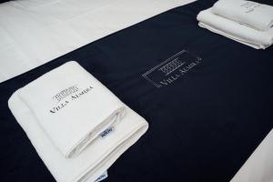 two white towels sitting on top of a table at Villa Almira in Izola +156 photos