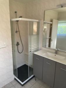a bathroom with a shower and a sink at Gîtes de La Ferme De Kereven in Bénodet +46 photos
