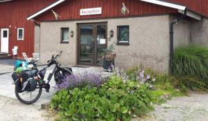 a motorcycle parked in front of a building at Rödlix Vandrarhem & Camping in Tvååker