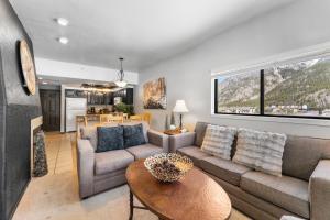 a living room with a couch and a table at Greens at Copper #314 in Copper Mountain +22 photos