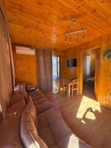 a living room with a couch and a table at Mtis guli in Bangveti