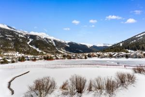 a view of a frozen lake in the mountains at Greens at Copper #217 in Copper Mountain