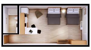 a floor plan of a room with two beds and boxes at LivAway Suites Phoenix-Surprise in Surprise +4 photos