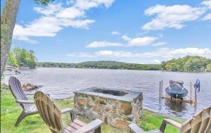 a fire pit in the middle of a lake at Lakeside Haven, Tranquil Waters in Holland
