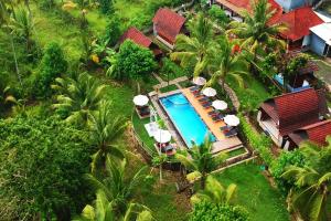 an aerial view of a resort with a swimming pool at Mamaras Guest House in Nusa Penida