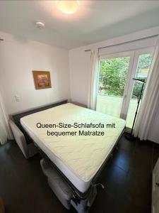 a hospital bed in a room with a window at Ferienwohnung W18 0 N in Graal-Müritz