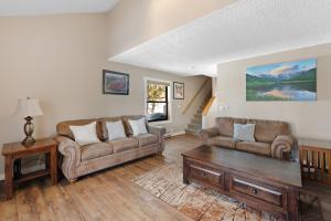 a living room with two couches and a coffee table at Rockridge #41 in Breckenridge