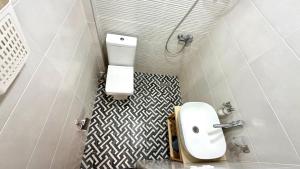 a bathroom with a toilet and a sink at Chalet Kvariati in Kvariat'i +29 photos