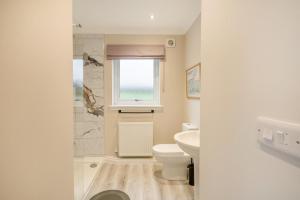 a bathroom with a toilet and a sink and a window at 2 Bed in Ochiltree oc-w37517 in Ochiltree +19 photos