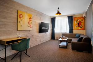 a living room with a couch and a table at Piata Unirii Central Apartments in Iaşi