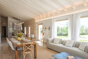 a living room with a white couch and a table at Can Soto in Palma de Mallorca