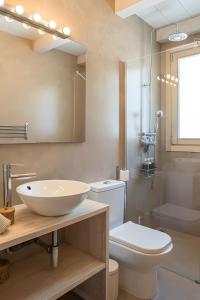 a bathroom with a sink and a toilet and a mirror at Can Soto in Palma de Mallorca +33 photos