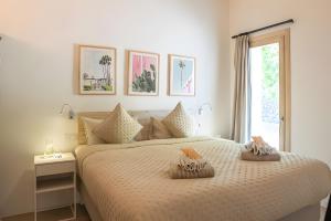 a bedroom with a bed with two pillows on it at Can Soto in Palma de Mallorca