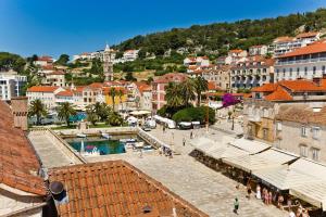 a view of a city with buildings and a town at Apartment Plaza in Hvar