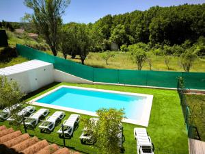 an image of a swimming pool in a yard at Casa La Huertona de Castroserna in Castroserna de Arriba