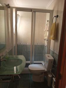 a bathroom with a toilet and a sink and a shower at Piso DE-MI-LA in Aspe +21 photos