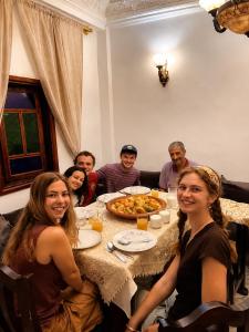 a group of people sitting around a table at Dar Amine in Rabat +60 photos