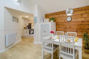 a kitchen and dining room with a table and chairs at 1 Bed in Lytham St. Annes oc-86044 in Saint Annes on the Sea