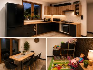 a kitchen with a black refrigerator and a table at U Margo nad rzeczką in Susiec