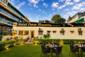 a view of the hotel new manila with tables and chairs at Hotel New Mamta by SSH 350 Metres from Nakki Lake in Mount Ābu