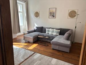 a living room with a couch and a table at Apartmán Růženka Písek in Písek