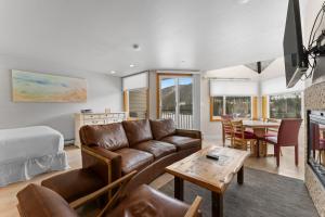 a living room with a couch and a table at Lakeside #1496 in Keystone