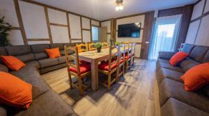 a living room with a table and a couch at La Casita de Lucia in Trescasas