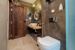 a bathroom with a toilet and a sink at Villa Lumora Maldives in Rasdhoo