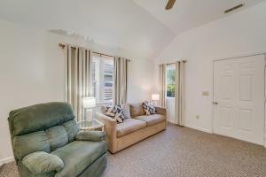 a living room with a couch and a chair at Chris Cottage 1 in Chincoteague