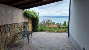 a patio with a table and a view of the water at ART Adria in Koper