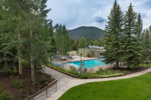 an aerial view of a house with a pool and trees at Plaza #1404 in Keystone