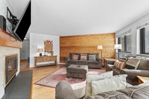 a living room with a couch and a fireplace at Plaza #1404 in Keystone
