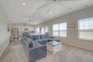 a living room with a couch and a table at Dock Holiday in Greenbackville