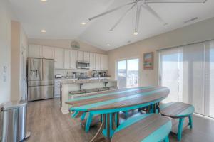 a kitchen with a table and some chairs in it at Dock Holiday in Greenbackville
