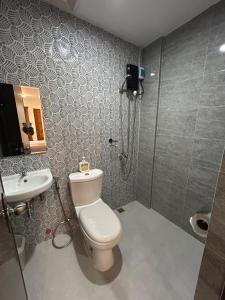 a bathroom with a toilet and a sink at Residencia de Azucena in Tacloban +48 photos