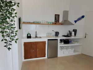a kitchen with a sink and a counter top at Art & Motion Union - Sunrise Room in Andros