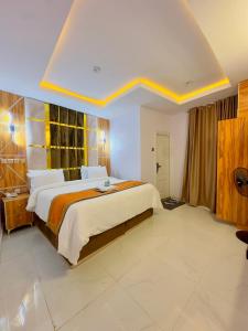 a bedroom with a large bed in a room at Don Marble Hotel And Suites in Auchi +45 photos